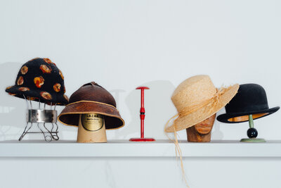 A row of colorful hats against a white background