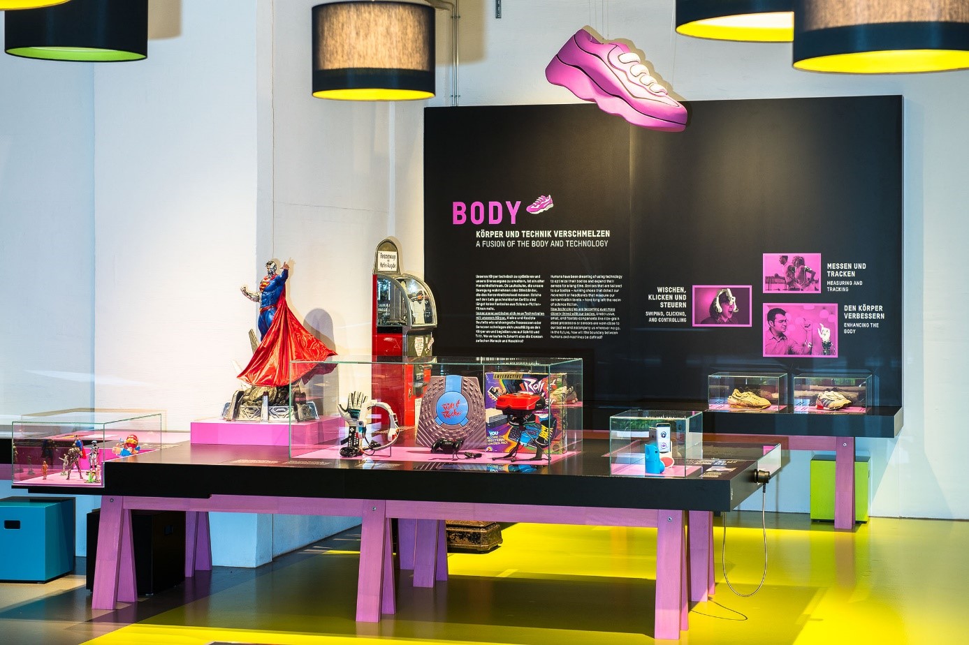 A view of the "Body" exhibition area, featuring various objects on a table and an information panel