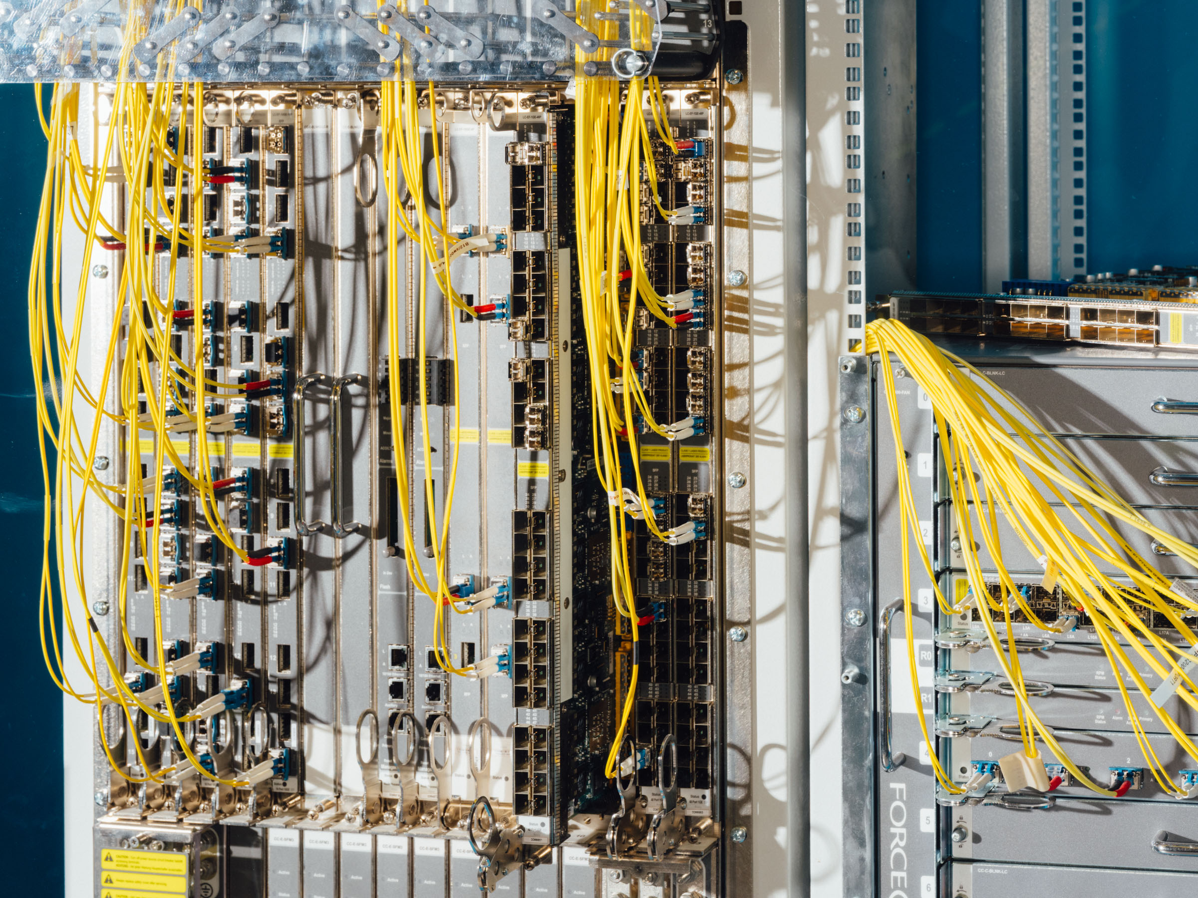 A look inside a server cabinet with a multitude of cables