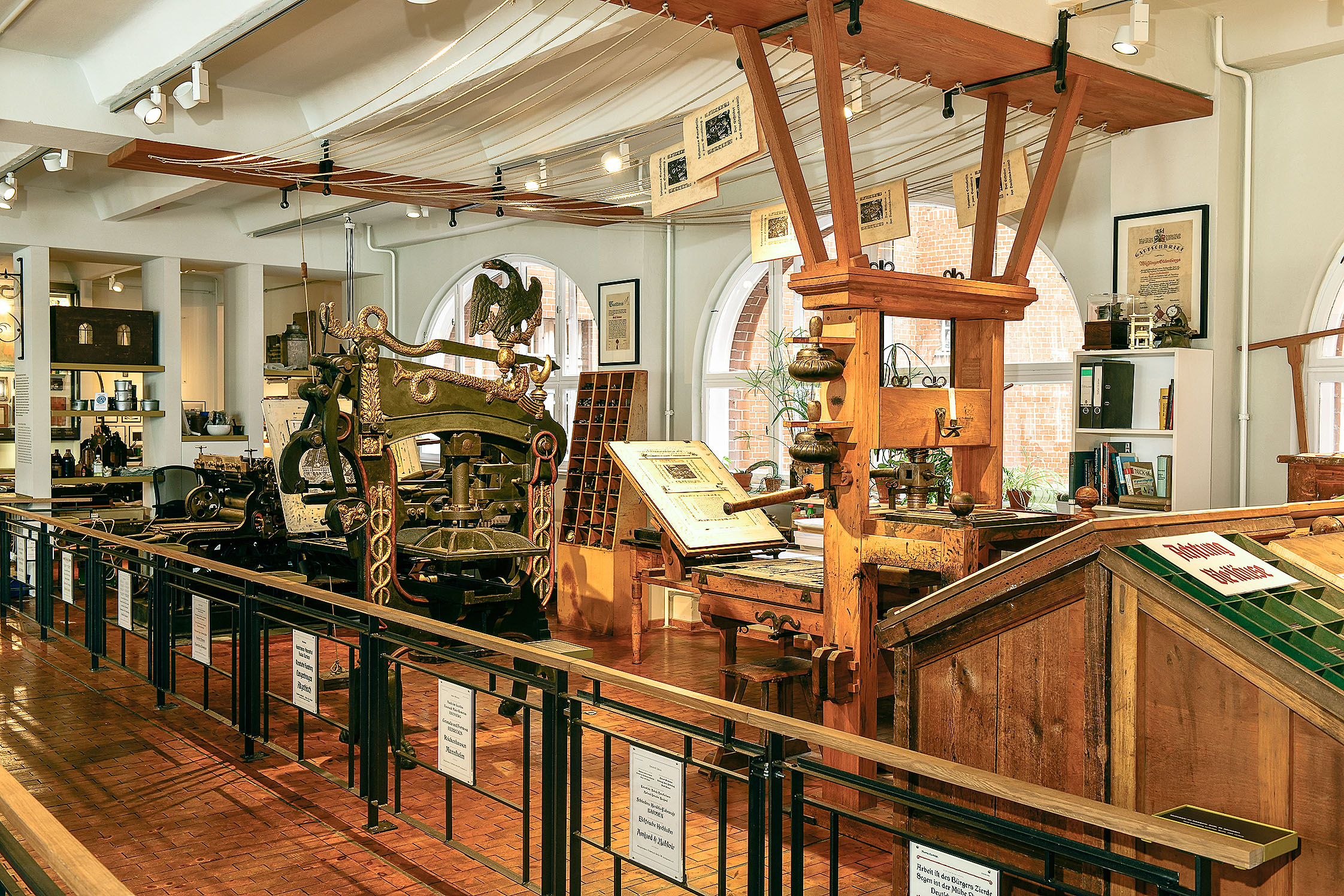 A view of the exhibition hall featuring various printing presses.