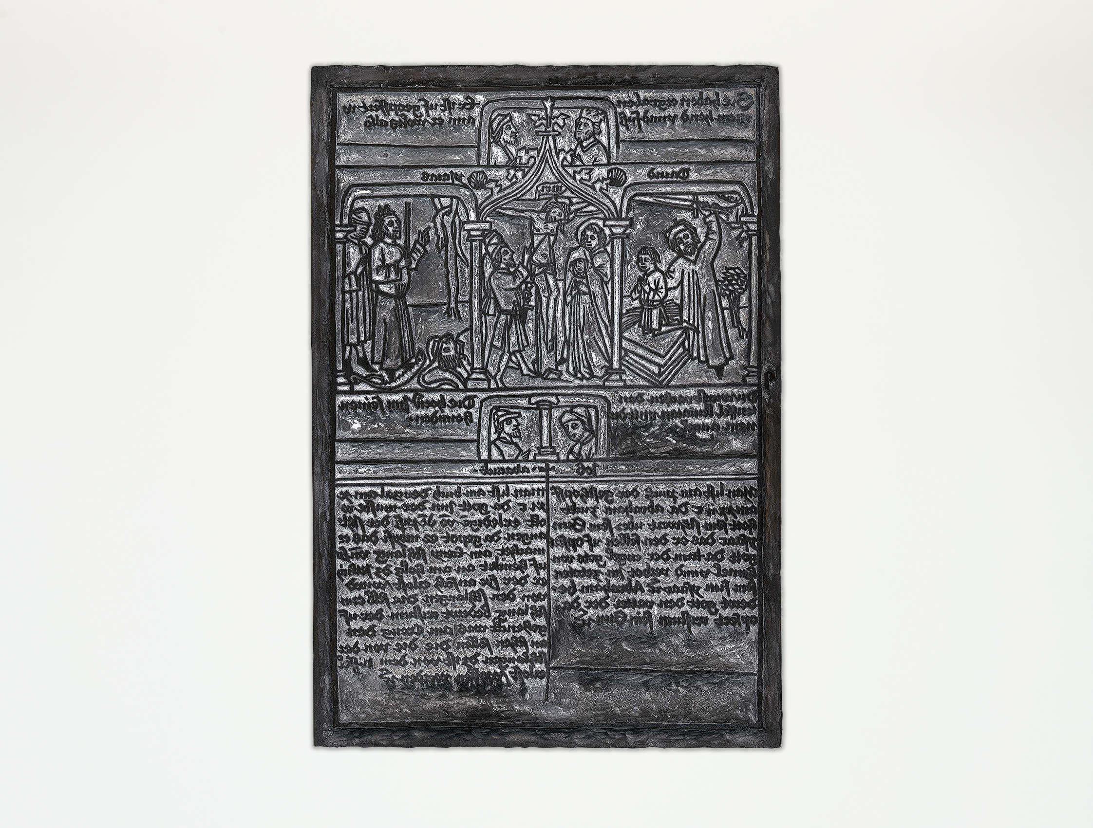 The upper half of the wooden printing block for a "poor man's Bible" features religious motifs. In the center is Jesus on the cross; the lower half contains text.