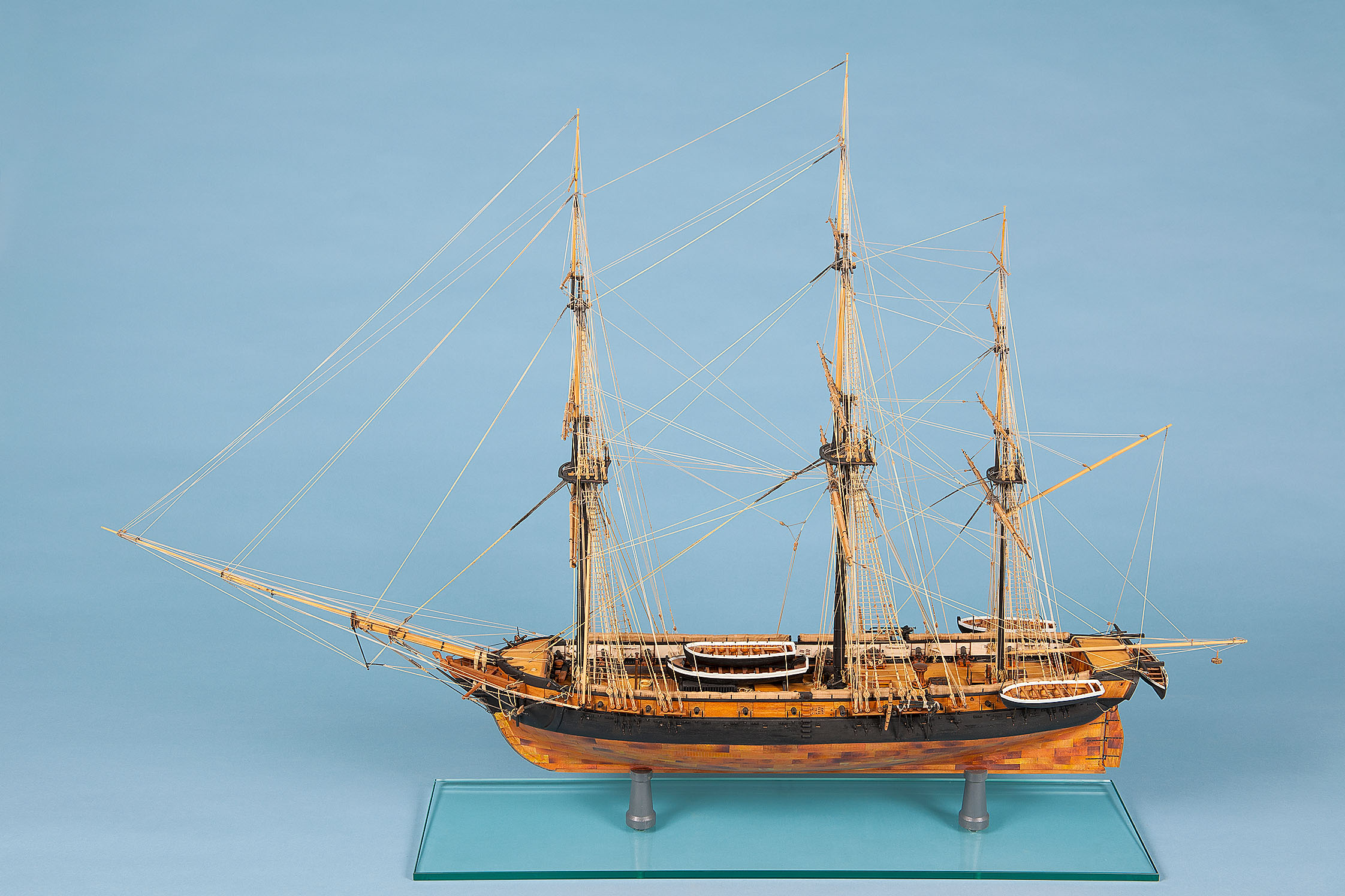 The 1:50 scale replica of the three-masted ship Creole is made of wood. The model is approximately 80 centimeters long and 20 centimeters tall.