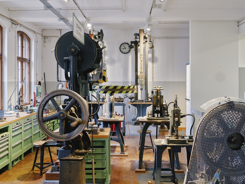 A view of a room containing various large, wheeled machines.