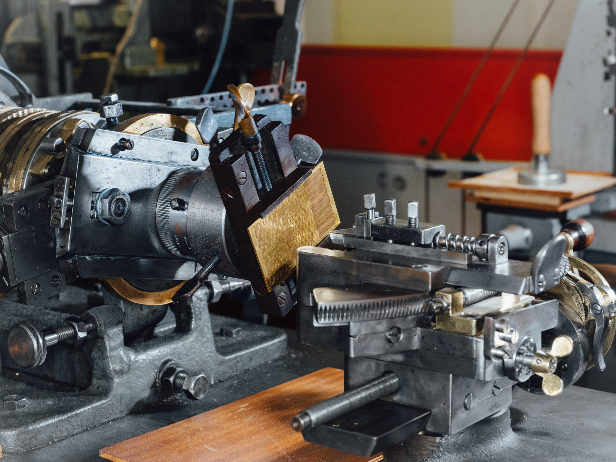Close-up view of the guilloché machine. It is used to engrave geometric patterns into pieces of metal.